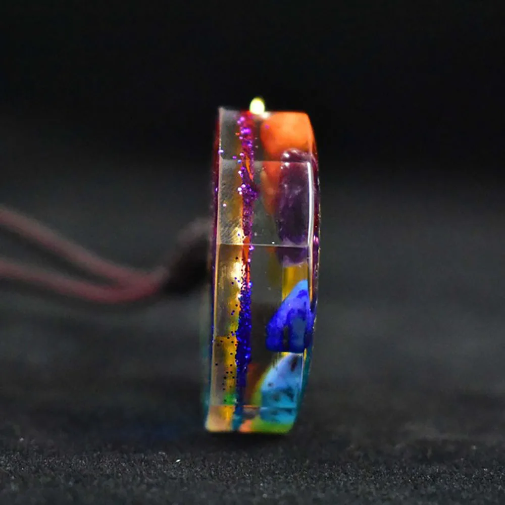 H09f1236df8f542c5a2c6d2113a395bf2I.webp 7 Chakra Orgonite Pendant Om Symbol Luminous Necklace Healing Crystals Energy Generator for Reiki Meditation Jewelry 1.38 inch